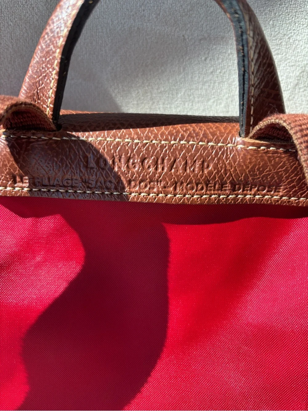 Longchamp Le Pliage Red Women's Nylon Backpack with Brown Leather Flap